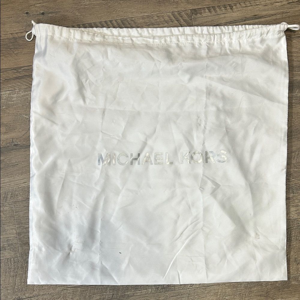 A13 | Michael Kors white dust jacket